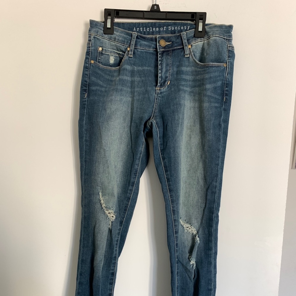 Soft/stretch mid rise distressed denim.